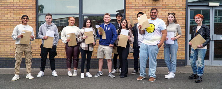 results day - photo of young people with their exam results
