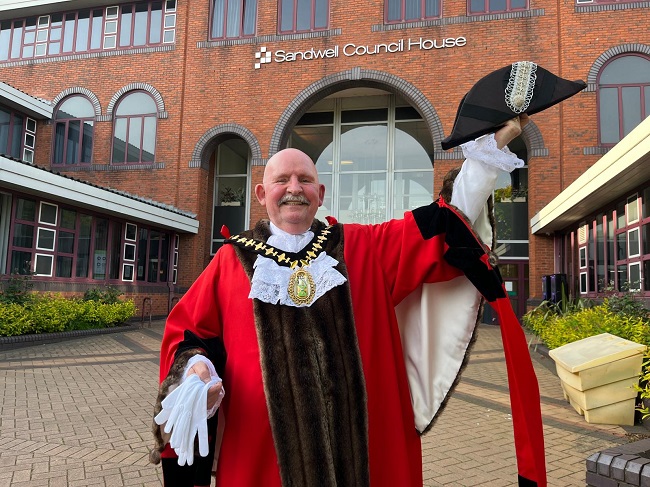 An image of Mayor of Sandwell Cllr Bill Gavan in his ceremonial robes and chains outside Sandwell Council House